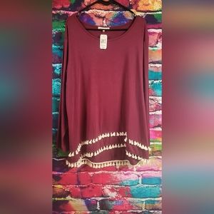 Tunic with tassels at bottom